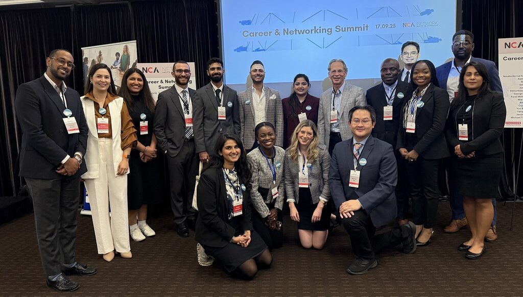 Group of NCA Network members and legal professionals posing together at a career and networking summit